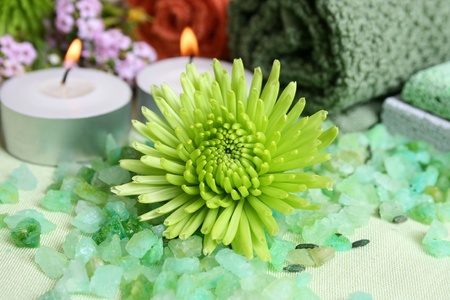 Spa Accessories setting with face cloths, candles and flowers の写真素材