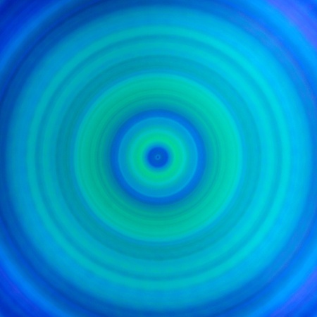Circular shades of blue and green spiral backgroundの写真素材