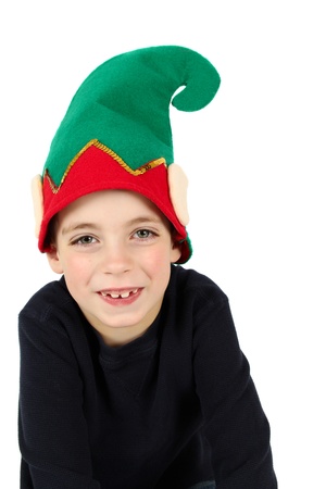 Seven year old boy wearing a christmas hatの写真素材