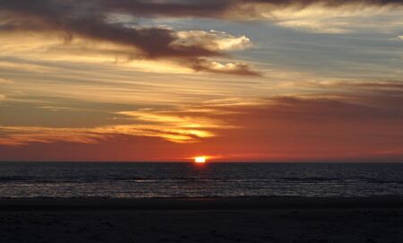 beautiful and colorful sunset on cadiz beach in southern spainの写真素材
