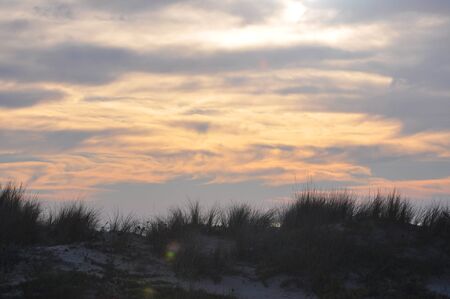 beautiful and colorful sunset on cadiz beach in southern spainの写真素材