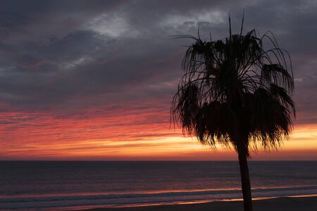 beautiful and colorful sunset on cadiz beach in southern spainの写真素材