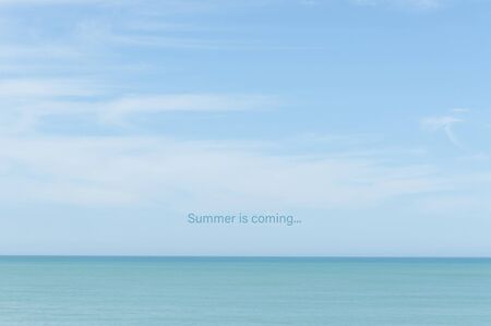 turquoise sea scene with soft blue sky with cloudsの写真素材