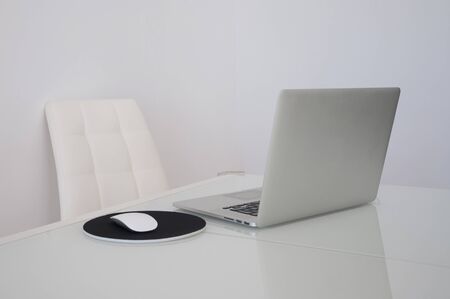 a work table with computer on white backgroundの写真素材