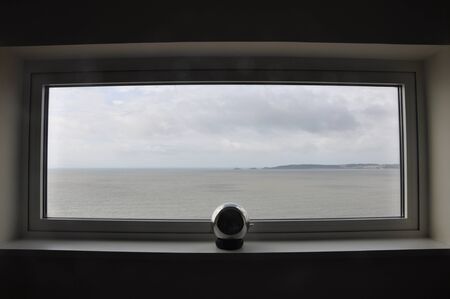 nice beach scene through a window in swansea in welshの写真素材