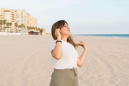 portrait of a beautiful young woman on the beachの写真素材