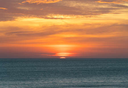 wonderful and colorful sunset on the beachの写真素材