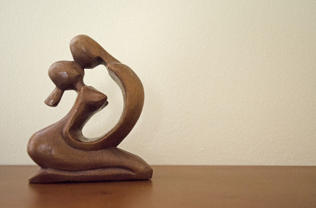 Loving couple Woodcarvingの写真素材