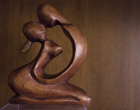 Loving couple Woodcarvingの写真素材