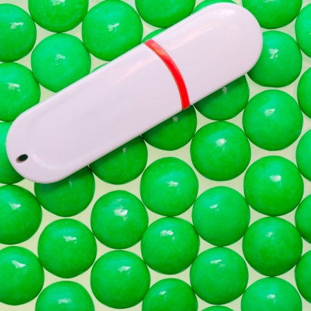 White USB flash drive on the green ballsの写真素材