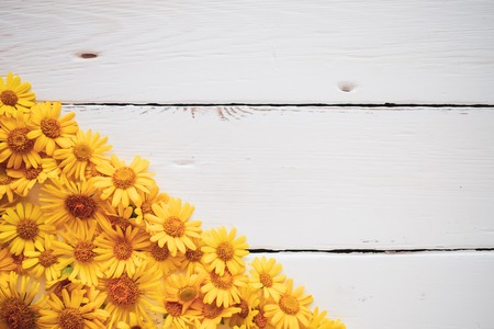 White Board vintage background with yellow flowersの写真素材