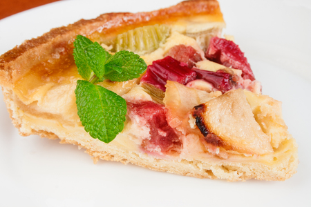 French tart with apples and rhubarb, close up.の写真素材