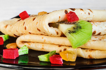 Delicious pancakes with fresh and dried fruits.の写真素材