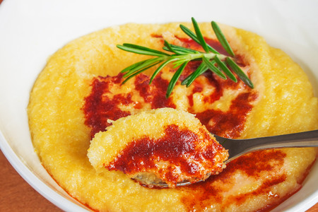 Polenta with butter and red pepperの写真素材