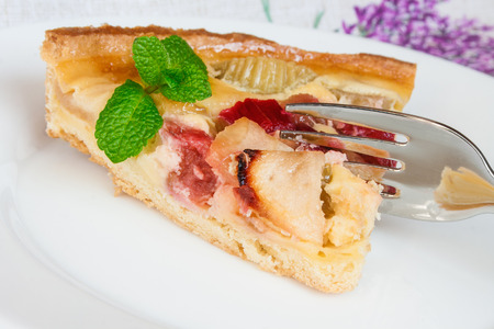 French tart with apples and rhubarb close up.の写真素材