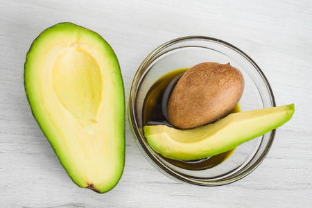 Avocado and avocado oil close up.の写真素材