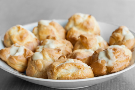 Profiteroles in white plateの写真素材