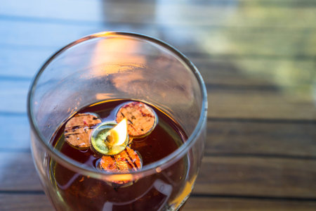 Flame on wick which is floating in the glass oil lampの写真素材