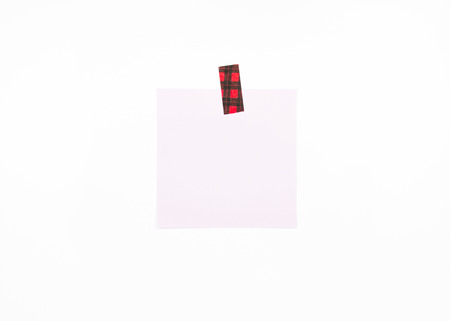 Blank note with pattern tape isolated on white background with soft shadow.の写真素材