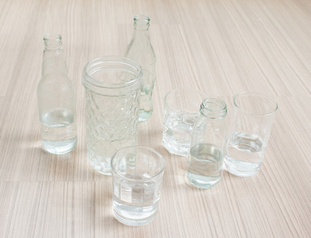 Glasses of water on wood background.の写真素材