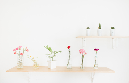 Decorate wood shelf with cactus and  flowers on wood table.の写真素材