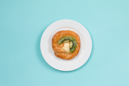 Danish kiwi on soft blue background.の写真素材