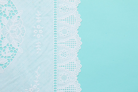 Top view of white lace pattern on green backgroundの写真素材