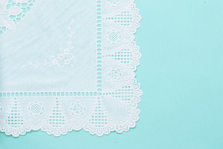 Top view of white lace pattern on green backgroundの写真素材