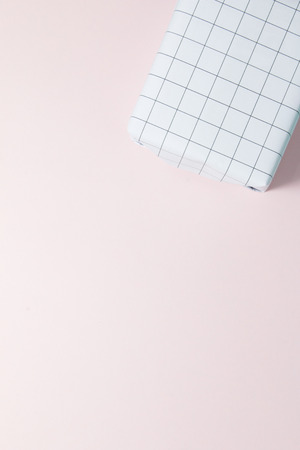 Top view of gift box on pink background.の写真素材