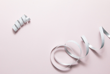 Ribbon twist on pink background.の写真素材