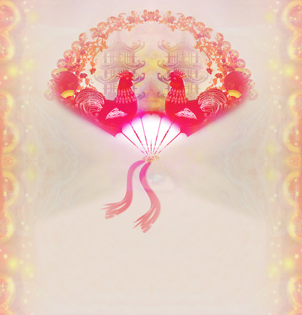 Decorative opened fan with patterns of Year of rooster design の写真素材