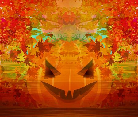 Scary Halloween pumpkin with leavesの写真素材
