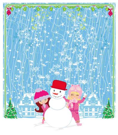 happy girls make a snowman on a beautiful winter's dayのイラスト素材