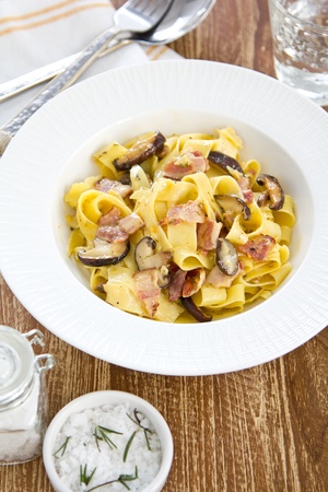 Fettuccine Carbonara with bacon and mushroomの写真素材