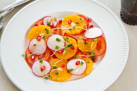 Orange,Pomegranate and tomato saladの写真素材