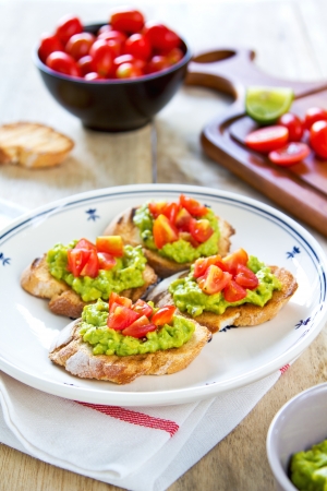 Toast baguette with avocado and tomatoの写真素材
