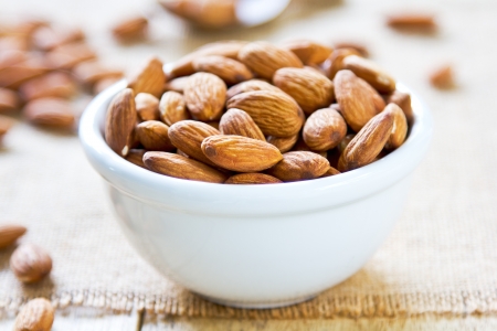 Almonds in a white bowlの写真素材
