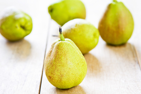 Some fresh European pear on wood boardの写真素材