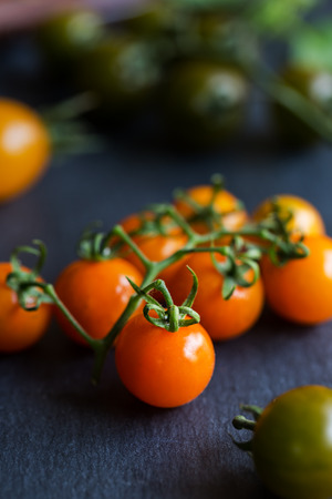 Varieties color of Cherry Tomatoes on stone boardの写真素材