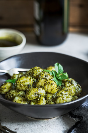 Gnocchi with homemade Basil Pesto sauce in a bowlの写真素材