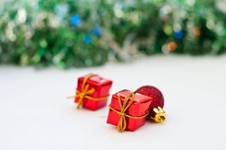 Christmas gifts isolated on white with garlandsの写真素材