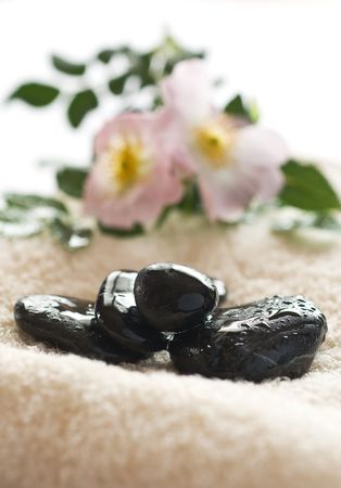 Zen like spa with wet black stonesの写真素材