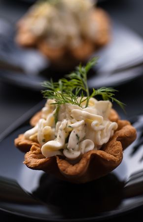 Cold tartalette with cheese cream and dillの写真素材