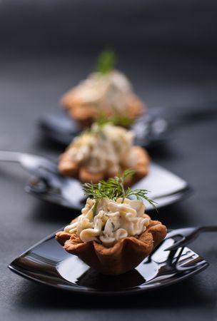 Cold tartalette with cheese cream and dillの写真素材