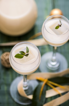 Creamy orange liqueur with Christmas decorationの写真素材