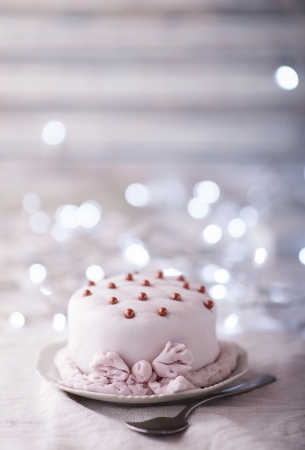 Small festive cake decorated with pearlsの写真素材