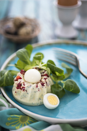 Egg nest appetizer with greensの写真素材