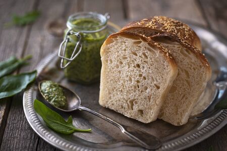 Homemade bread with spinach pestoの写真素材