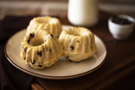 Homemadechocolate chip cakes with milkの写真素材