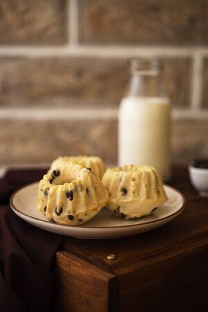 Homemade chocolate chip cakes with milkの写真素材